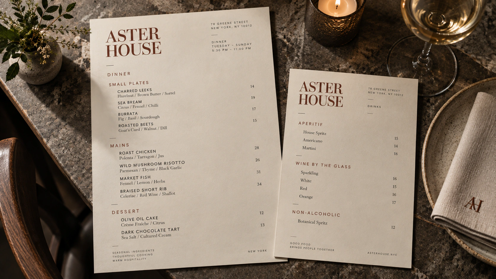 Aster House menu system using serif typography and restrained neutral paper stocks.